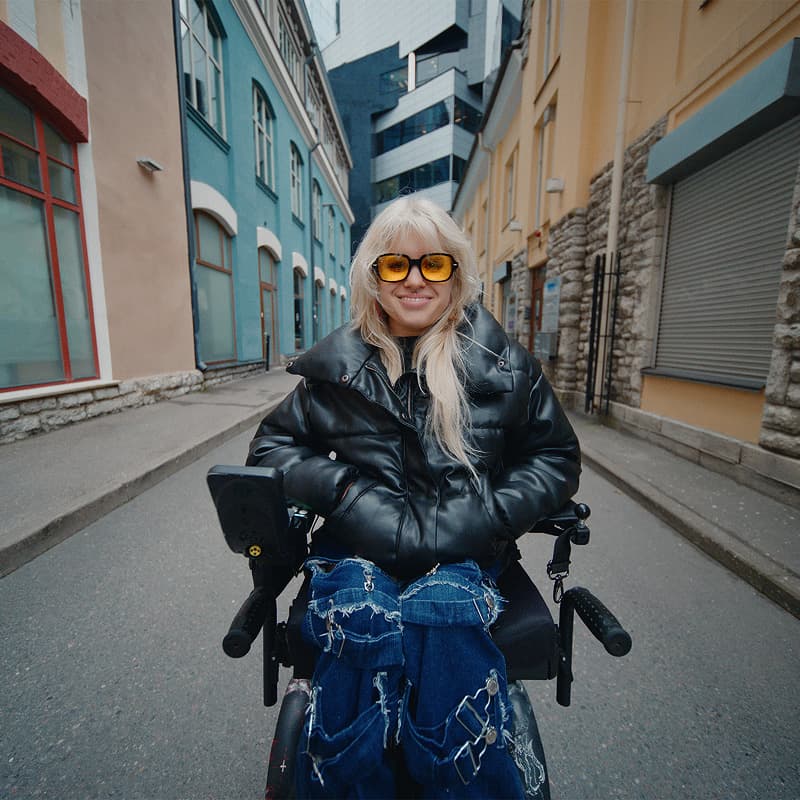 Hendra Raud in a wheelchair on a city street