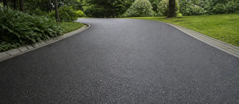 Illustrative smooth asphalt path through a green urban park