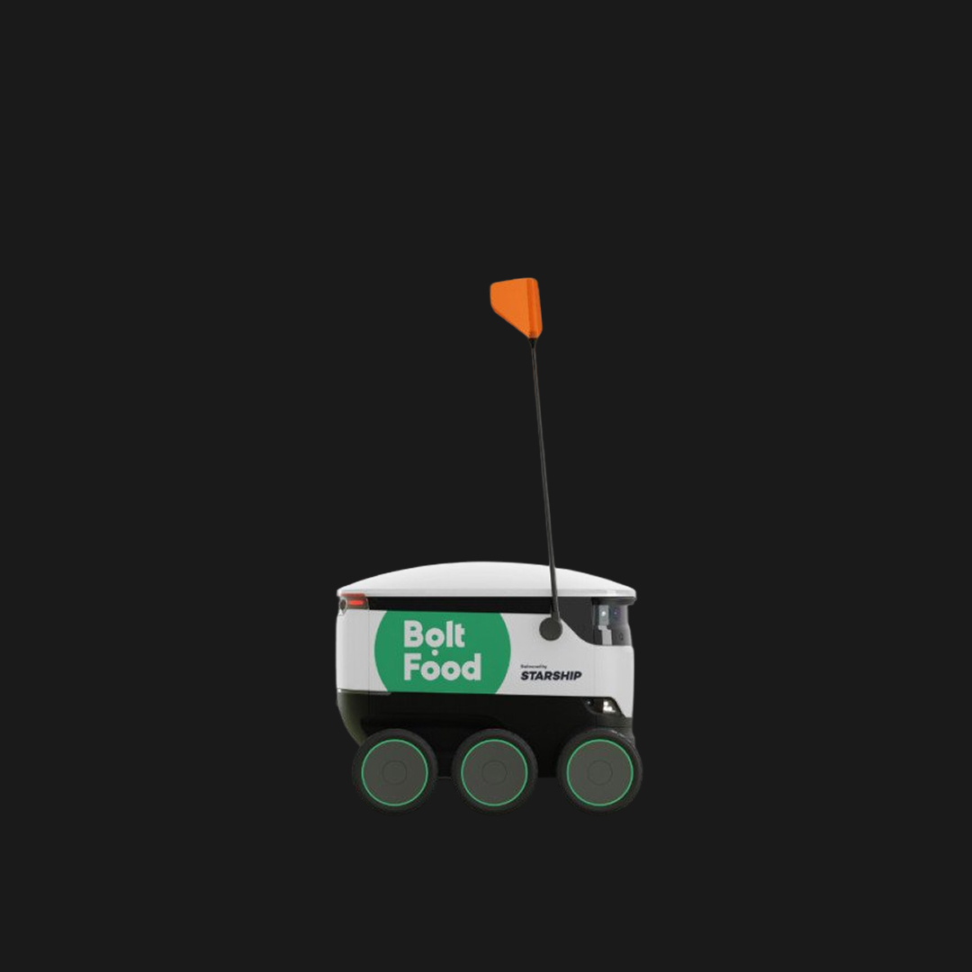 An autonomous vehicle photographed against a dark background